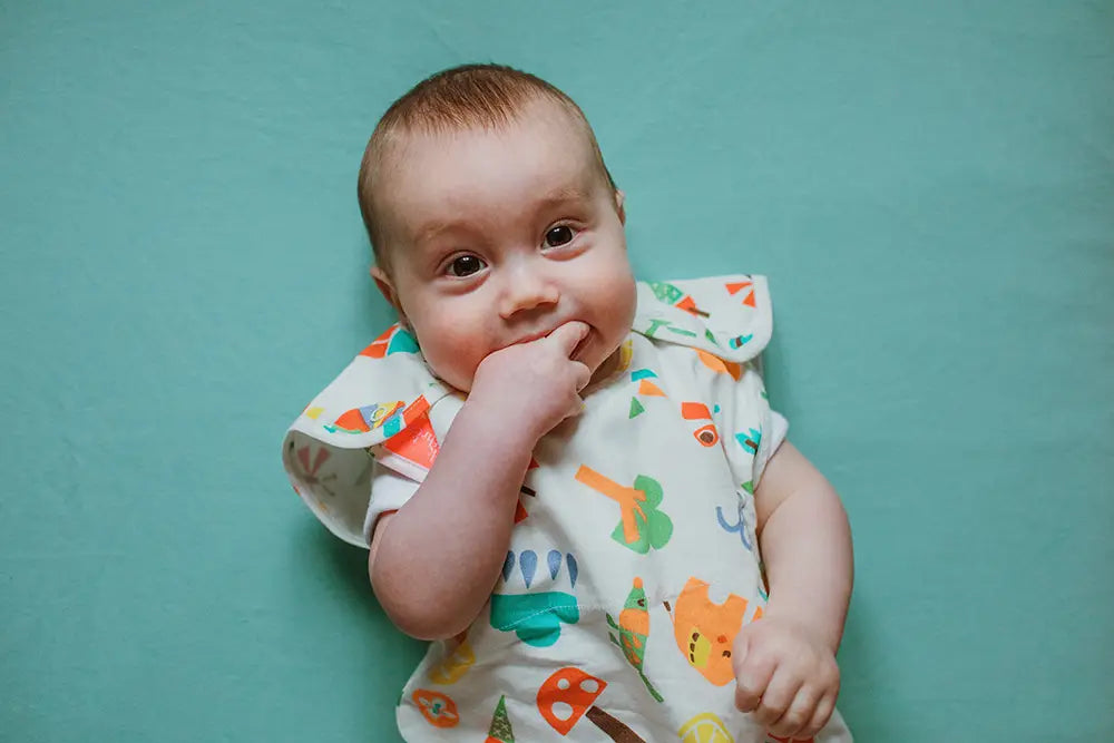 Baby on green sheet